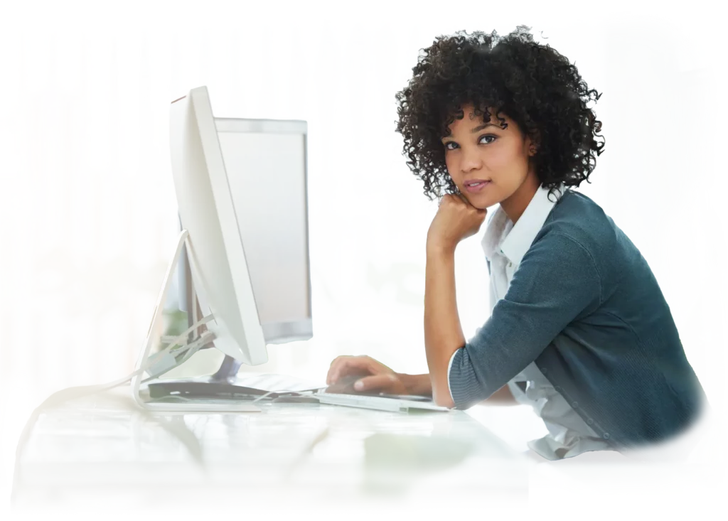 African American woman in front of double monitor